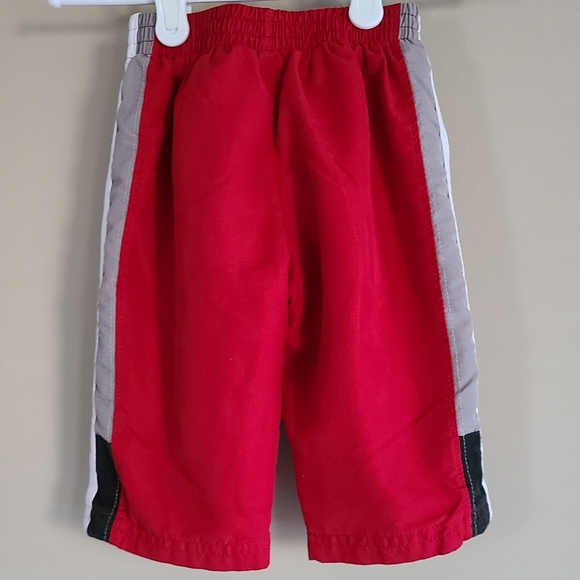 NIKE red lined splash pants - Picture 2 of 3